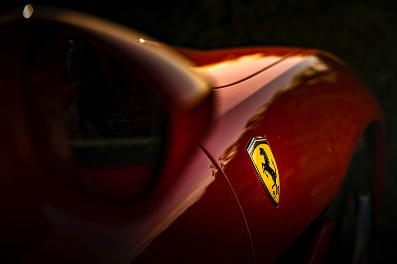 selective focus photo of ferrari emblem