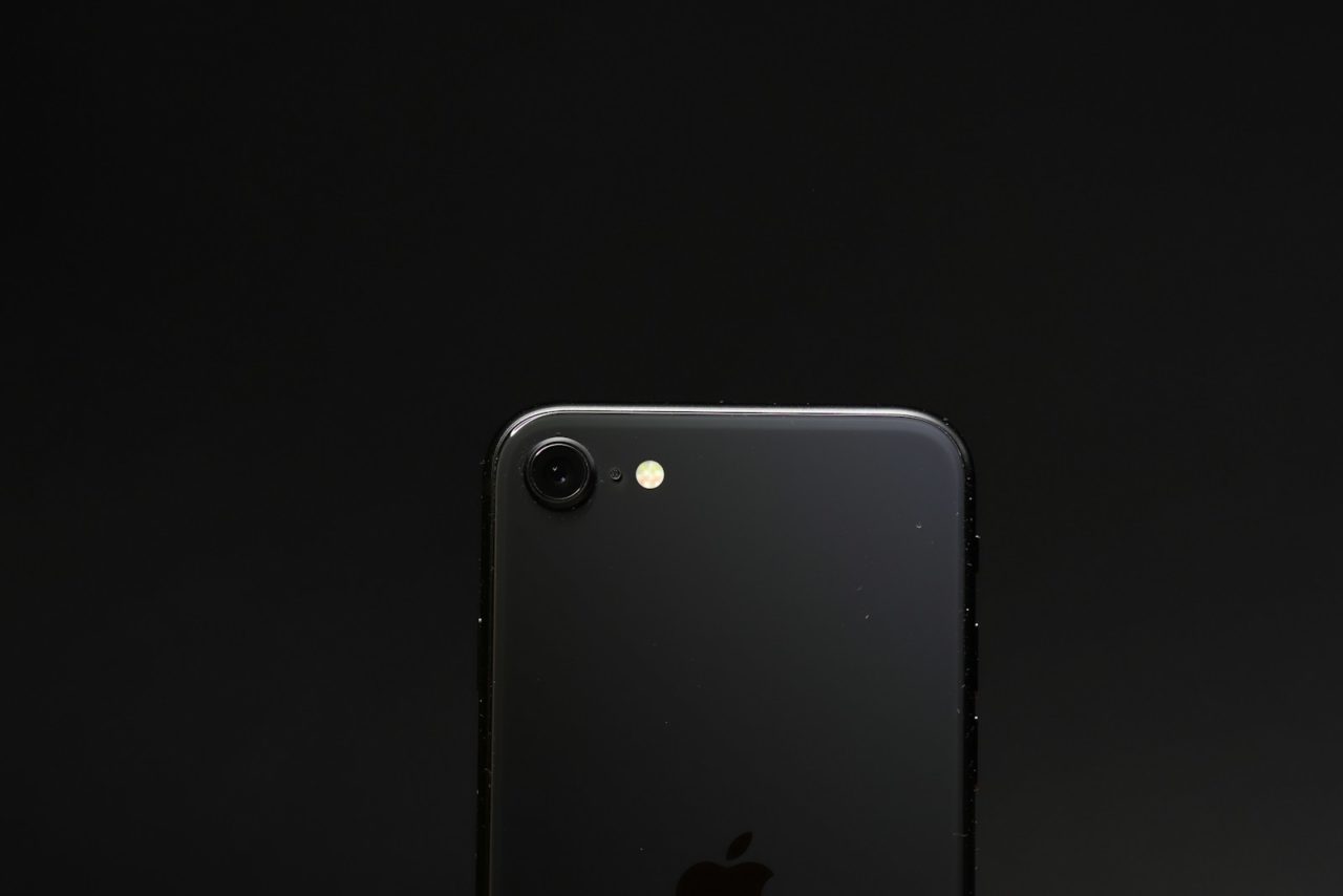 white iphone 5 c on white surface